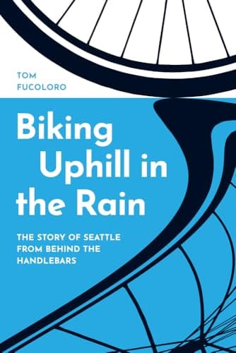 Cover of Biking Uphill in the Rain: The Story of Seattle from behind the Handlebars